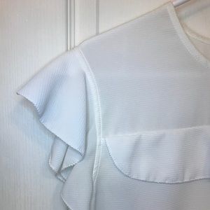 Zara white short sleeve blouse with ruffles.